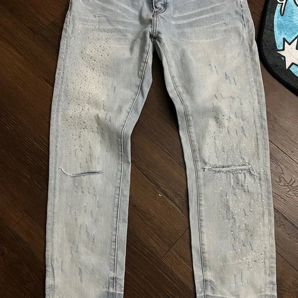 Amiri Light Wash Distressed Skinny Jeans